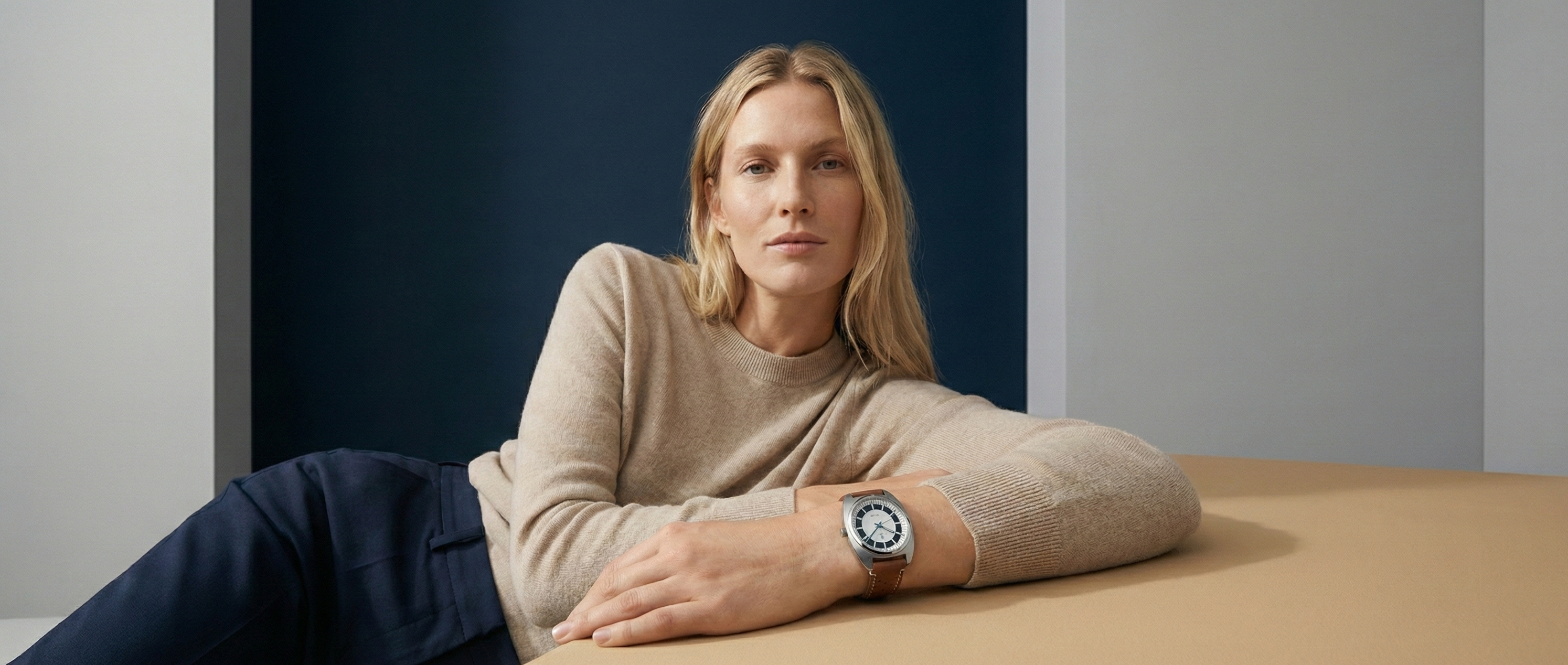 Woman wearing a watch in a minimalistic setting